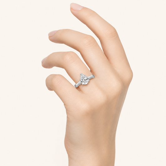 1.25 CT Pear Cut Lab Grown Diamond Side Stone Ring