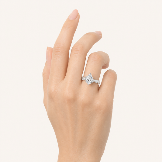 1.25 CT Pear Cut Lab Grown Diamond Side Stone Ring