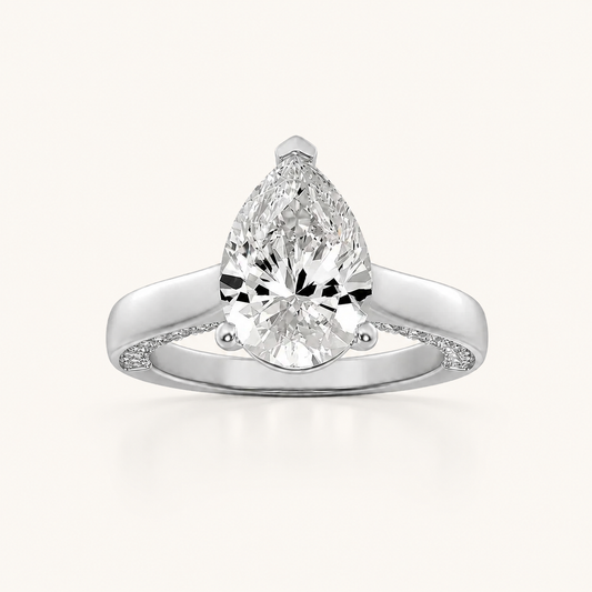 1.25 CT Pear Cut Lab Grown Diamond Side Stone Ring